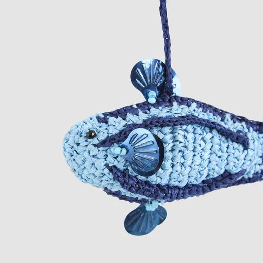 Close-up of the blue crochet fish Christmas ornament