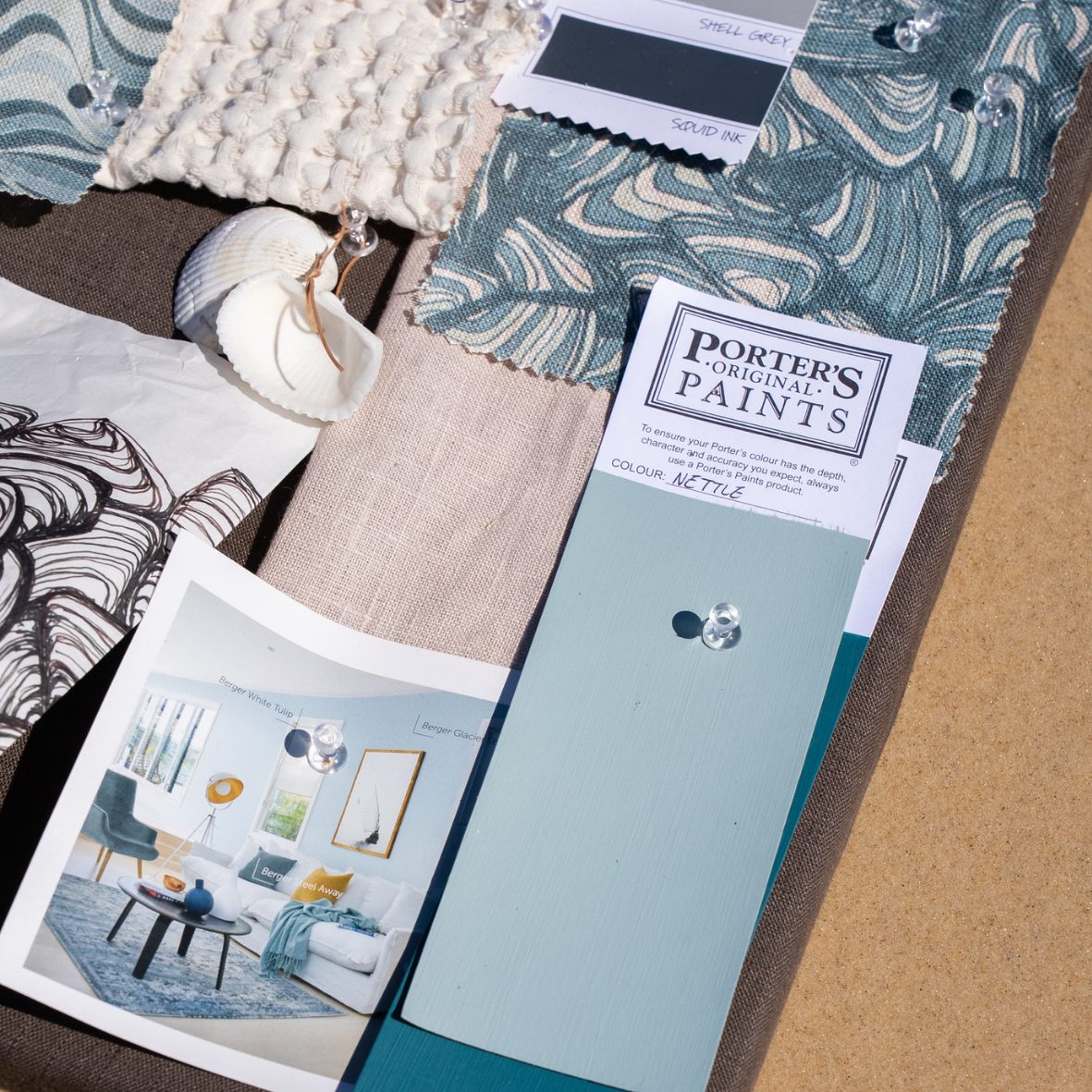 Mood board for the Frenchmans Pipi linen cushion cover with fabric swatches, shells and blue-green paint samples.