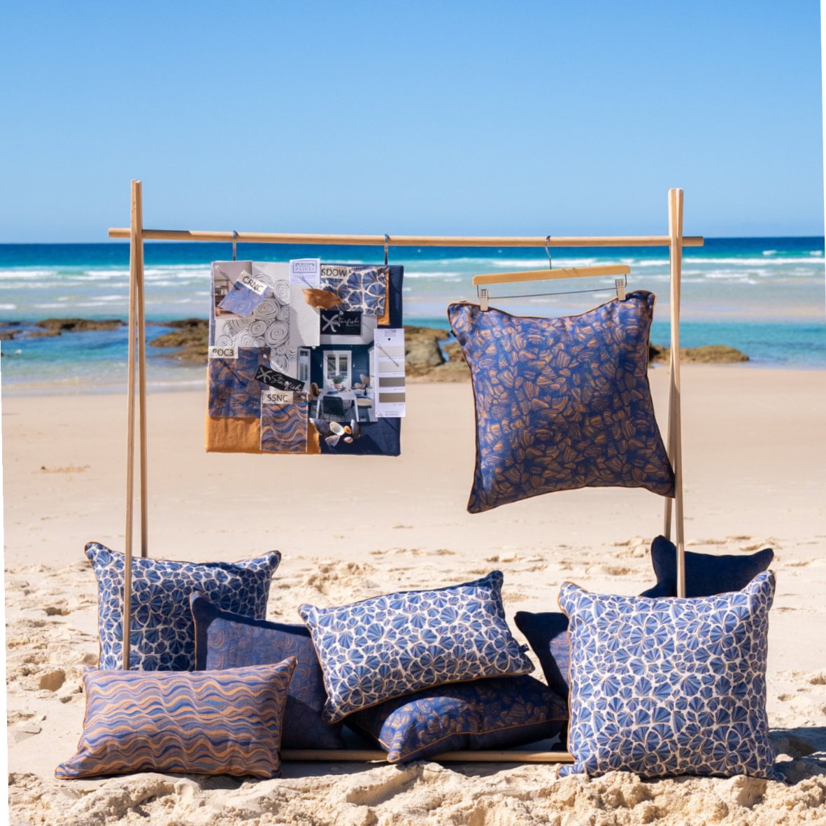 Mariner linen cushion collection displayed on the beach with Shells and coordinating coastal patterns
