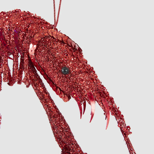 Close-up of the orange glitter prawn Christmas decoration